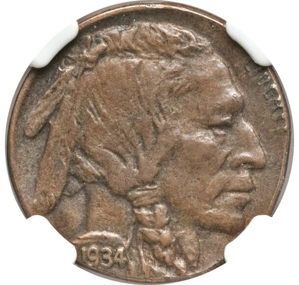 1934 Buffalo nickel struck on a wrong one-cent copper planchet — copper colored and smaller than a standard nickel with design cut off